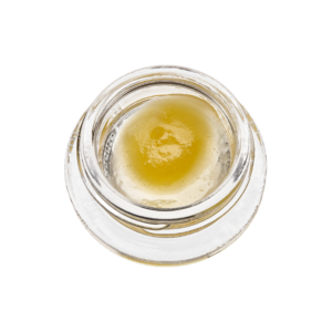 cannabis wax in container over white background