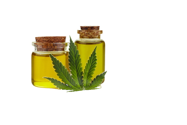 Two CBD oil containers and a hemp leaf over white background. CBD oil concept.