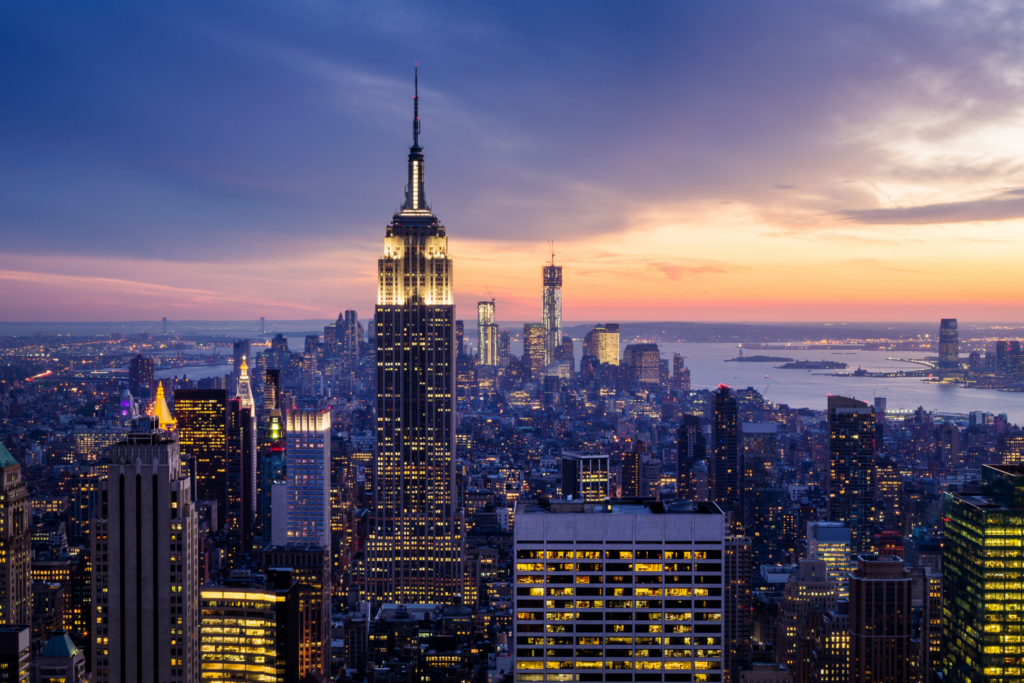 Airview of a Manhattan skyscraper at sunset.