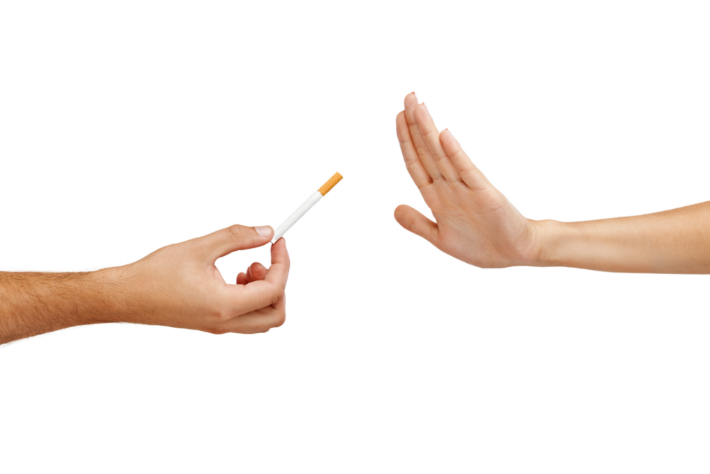 Hand rejecting cigarette offering. Quit smoking concept.